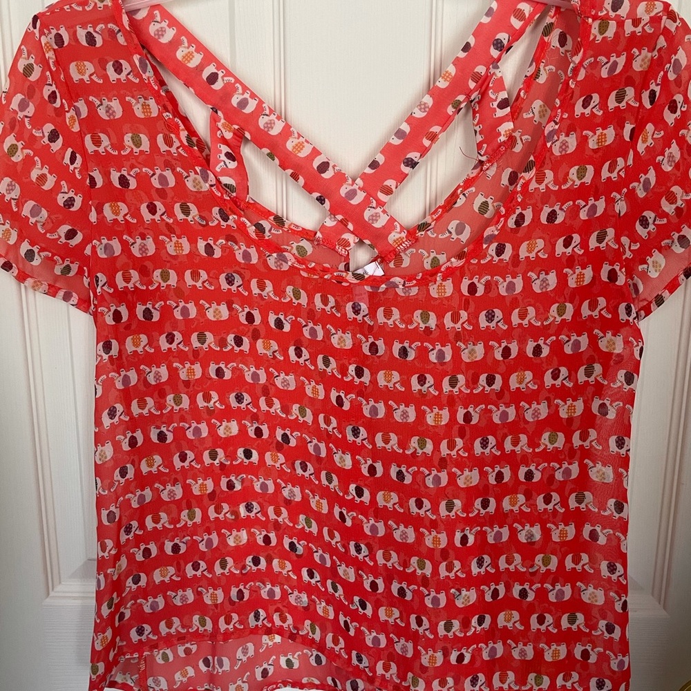 dELia*s orange patterned blouse